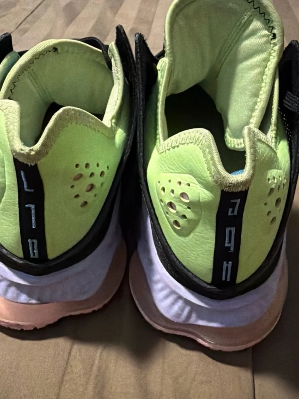 Nike Black Sneakers with Lime Green and Light Blue Accents